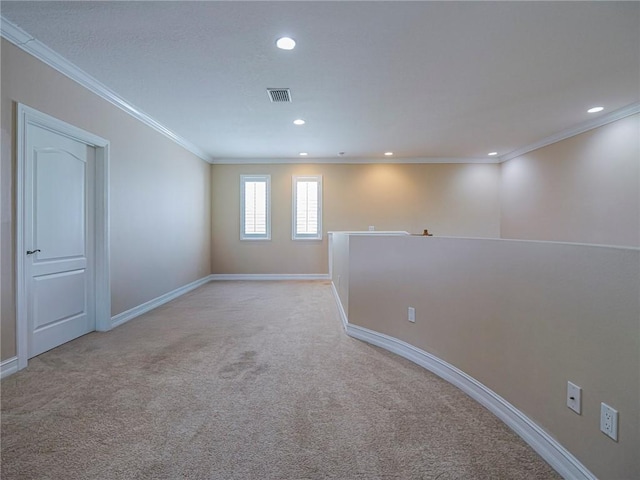 4570 Bridgepointe Way Unit 148, Vero Beach, FL 32967 - unfurnished room with light carpet, crown molding, and recessed lighting