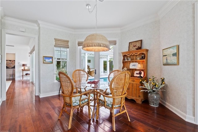 dining space with ornamental molding and dark wood-type flooring