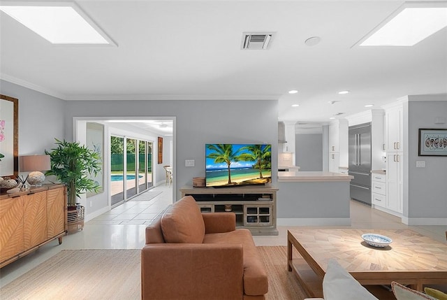 976 25th St, Vero Beach, FL 32960 - living room with light tile patterned floors, ornamental molding, a skylight, and recessed lighting