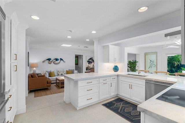 976 25th St, Vero Beach, FL 32960 - kitchen featuring a peninsula, open floor plan, dishwasher, recessed lighting, and white cabinetry