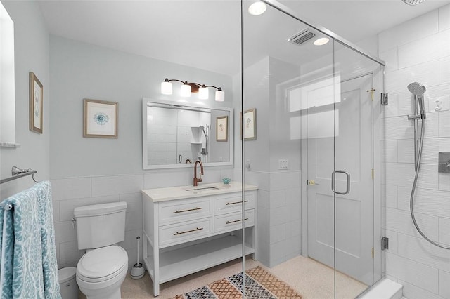 976 25th St, Vero Beach, FL 32960 - full bathroom with tile walls, vanity, and a shower stall