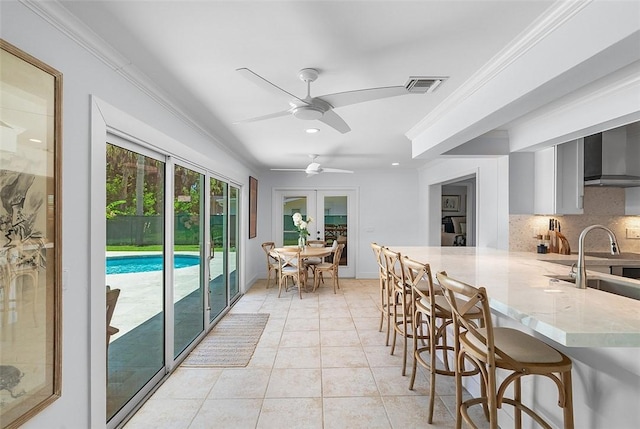 976 25th St, Vero Beach, FL 32960 - sunroom featuring a sink and french doors