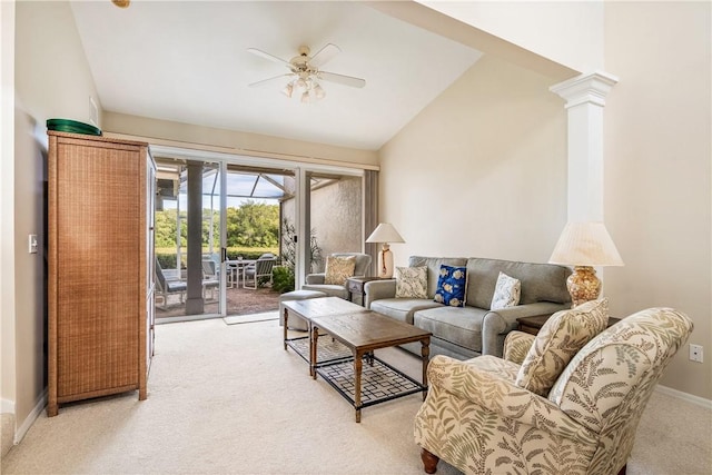 carpeted living room featuring ceiling fan, vaulted ceiling, and ornate columns