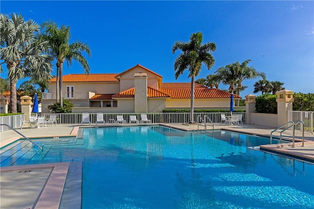 view of swimming pool with a patio