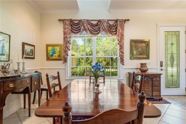 dining area featuring light tile patterned floors and crown molding