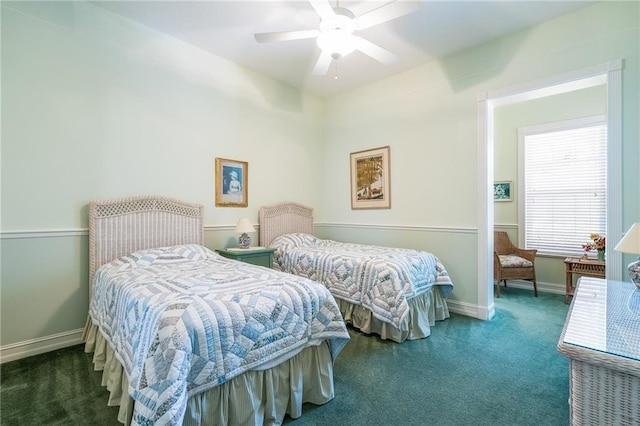 bedroom featuring baseboards, dark colored carpet, and a ceiling fan