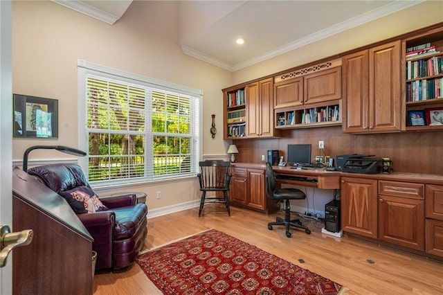 office featuring ornamental molding, light wood-type flooring, built in study area, and baseboards