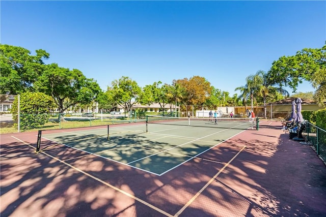 view of sport court with fence