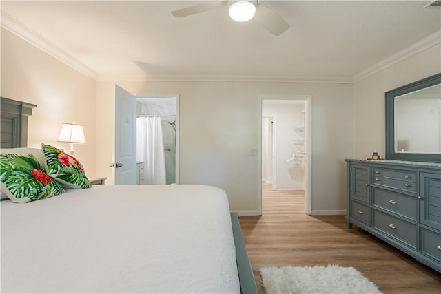 bedroom featuring ceiling fan, wood finished floors, baseboards, and ornamental molding