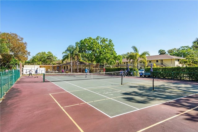 view of sport court with fence