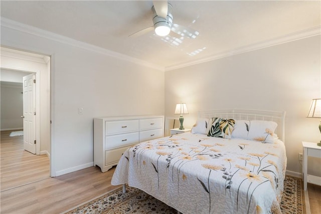 bedroom with crown molding, baseboards, light wood-type flooring, and ceiling fan