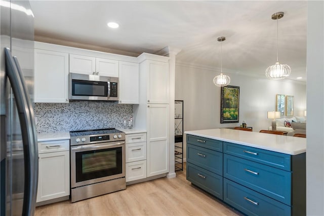 kitchen with light countertops, decorative backsplash, light wood-style flooring, white cabinets, and stainless steel appliances