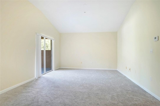 5060 Fairways Cir Unit F312, Vero Beach, FL 32967 - spare room with carpet, vaulted ceiling, and baseboards