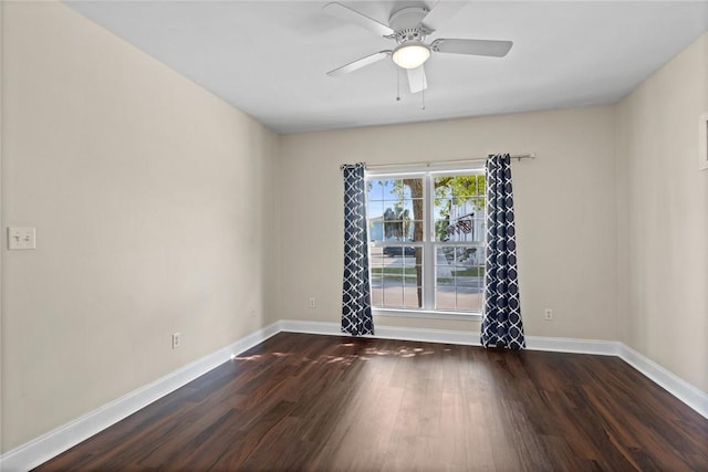 unfurnished room with wood finished floors, baseboards, and ceiling fan