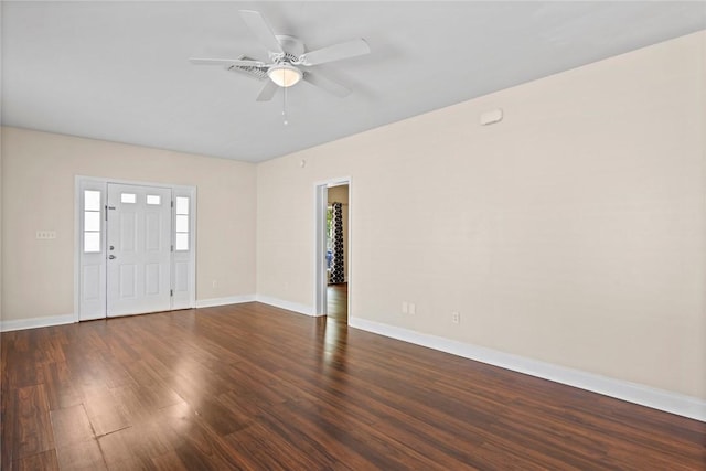 foyer featuring baseboards, dark wood finished floors, and a ceiling fan