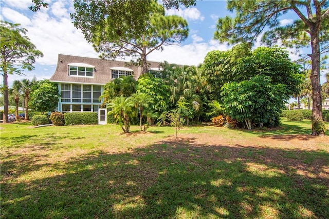 view of yard with a sunroom