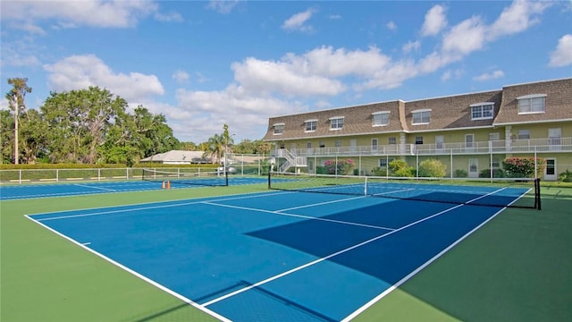 view of sport court featuring community basketball court and fence