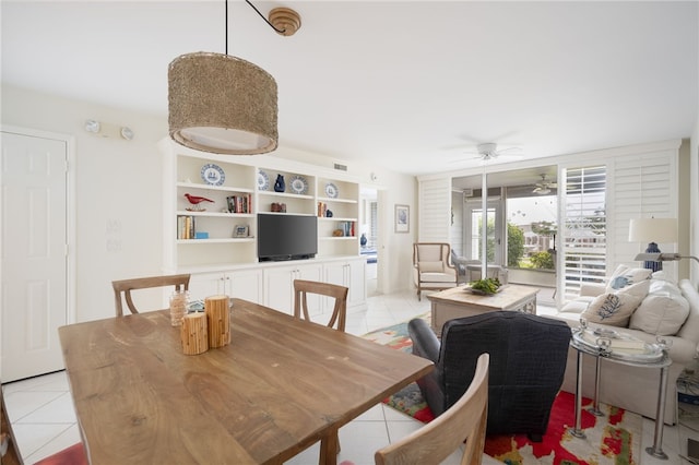 tiled dining space with ceiling fan