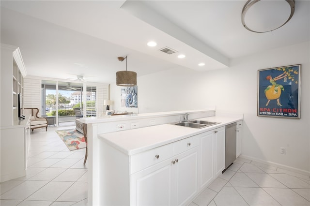 kitchen with white cabinets, stainless steel dishwasher, pendant lighting, and kitchen peninsula