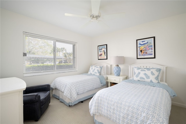 bedroom with light colored carpet and ceiling fan