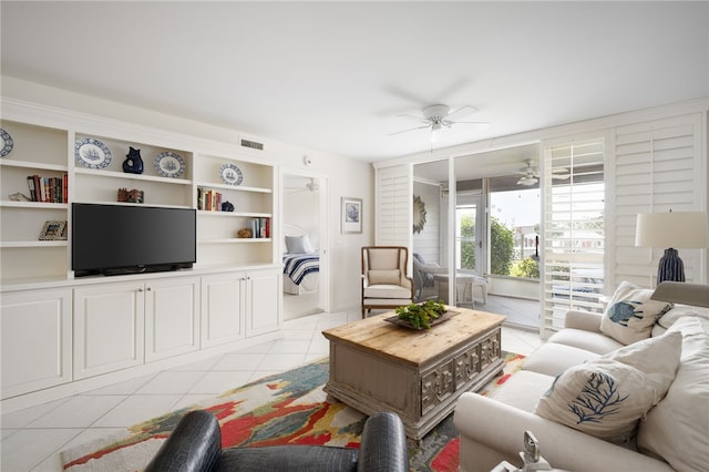 living room with light tile patterned floors and ceiling fan