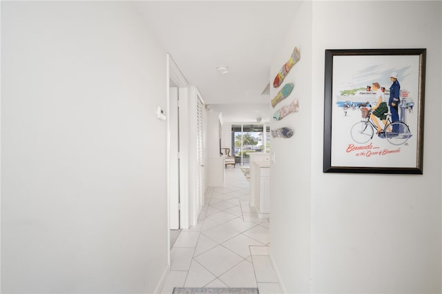 corridor featuring light tile patterned floors