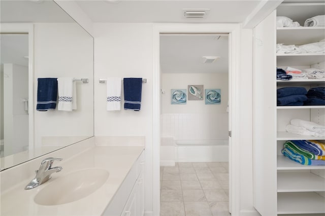 bathroom with vanity and tile patterned floors