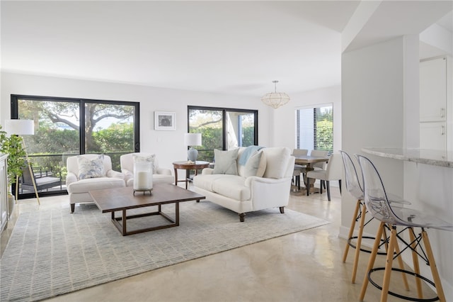 living room with a notable chandelier