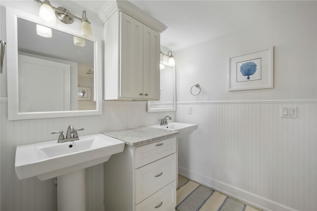 bathroom featuring double sink