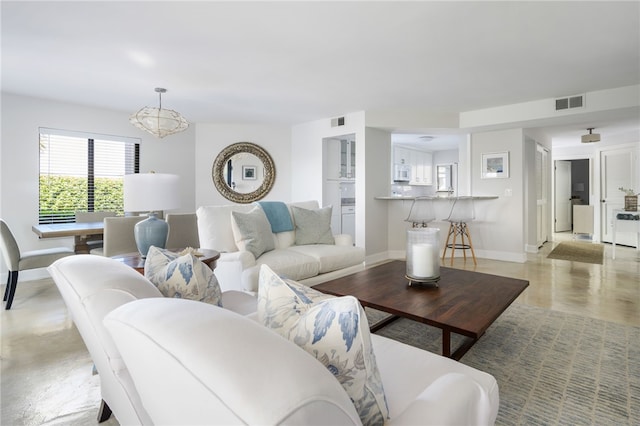 living room with a notable chandelier