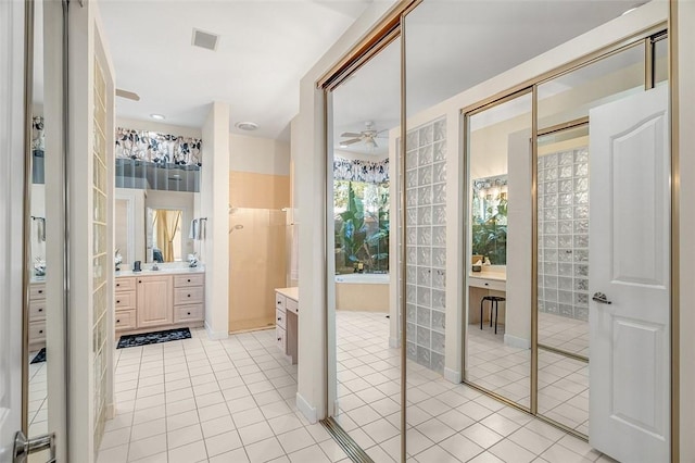 bathroom with vanity, ceiling fan, and tile patterned flooring