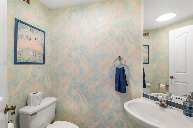 bathroom featuring sink and toilet