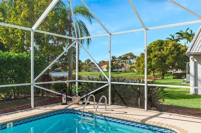 6157 Winding Lake Dr, Jupiter, FL 33458 - swimming pool with a lanai, a patio, a lawn, and a water view