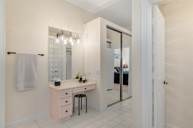 bathroom featuring tile patterned floors and vanity