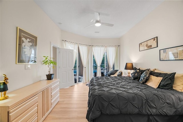 bedroom with ceiling fan, access to exterior, and light hardwood / wood-style flooring