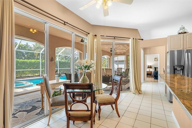 sunroom / solarium featuring ceiling fan and a pool