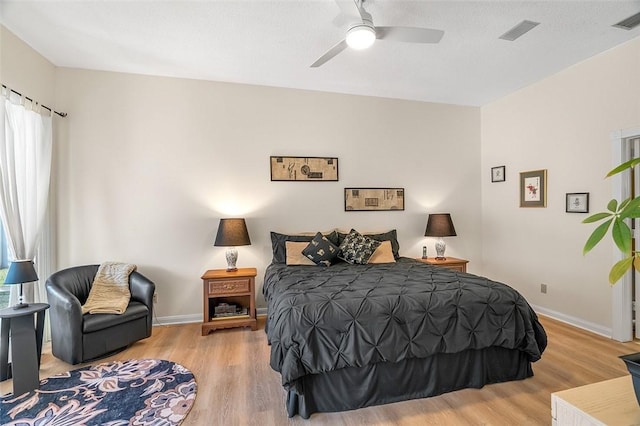 bedroom with light wood-type flooring and ceiling fan