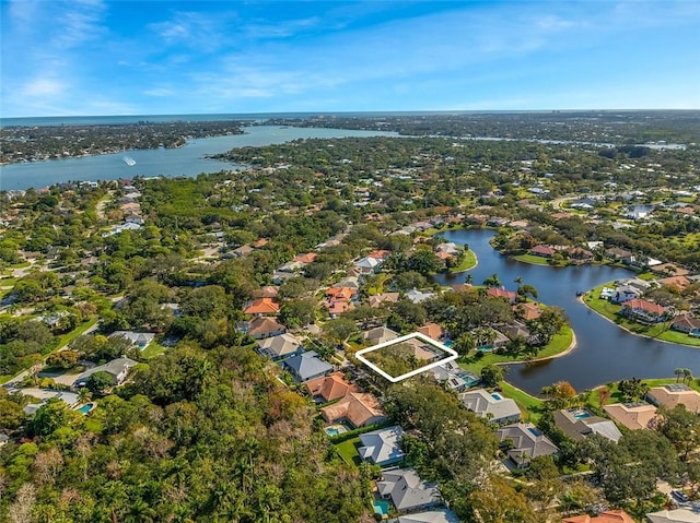 birds eye view of property with a water view