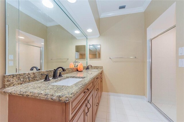 7941 Cabot Tower Pl, Vero Beach, FL 32966 - full bathroom with ornamental molding, double vanity, a shower stall, baseboards, and recessed lighting
