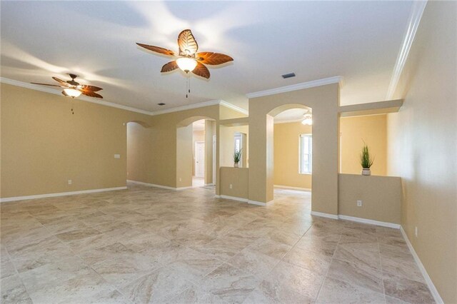 7941 Cabot Tower Pl, Vero Beach, FL 32966 - spare room with arched walkways, a ceiling fan, ornamental molding, and baseboards