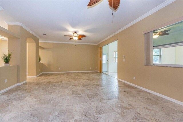 7941 Cabot Tower Pl, Vero Beach, FL 32966 - unfurnished room with ceiling fan, plenty of natural light, ornamental molding, baseboards, and stone finish floors