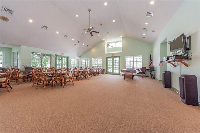 7941 Cabot Tower Pl, Vero Beach, FL 32966 - dining space with light carpet, high vaulted ceiling, ceiling fan, recessed lighting, and plenty of natural light