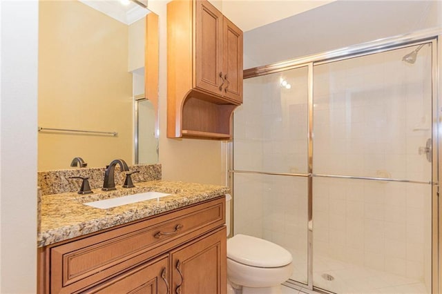 7941 Cabot Tower Pl, Vero Beach, FL 32966 - bathroom featuring toilet, vanity, and a stall shower