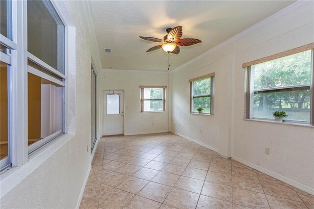 7941 Cabot Tower Pl, Vero Beach, FL 32966 - unfurnished room featuring ornamental molding, baseboards, ceiling fan, and light tile patterned flooring