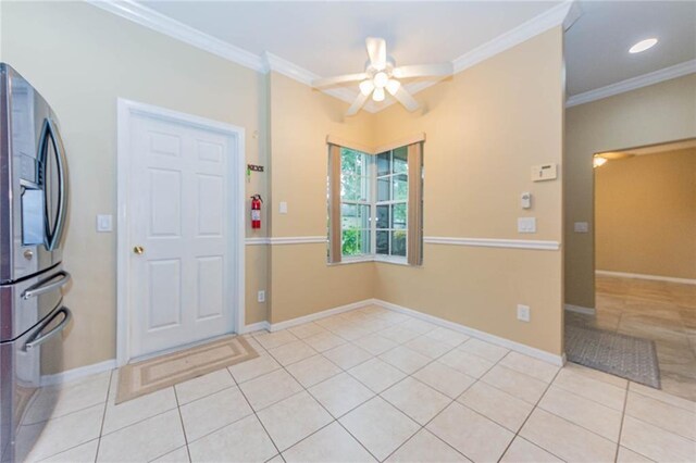 7941 Cabot Tower Pl, Vero Beach, FL 32966 - foyer featuring ceiling fan, light tile patterned floors, ornamental molding, and baseboards