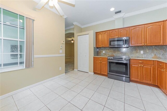 7941 Cabot Tower Pl, Vero Beach, FL 32966 - kitchen featuring stainless steel appliances, ceiling fan, crown molding, backsplash, and light tile patterned floors