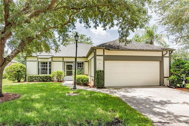 7941 Cabot Tower Pl, Vero Beach, FL 32966 - single story home with stucco siding, driveway, a garage, a front yard, and roof with shingles