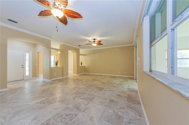 7941 Cabot Tower Pl, Vero Beach, FL 32966 - spare room with arched walkways, ceiling fan, ornamental molding, and baseboards