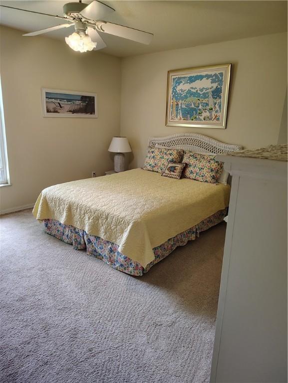 3932 58th Cir, Vero Beach, FL 32966 - bedroom with carpet and a ceiling fan