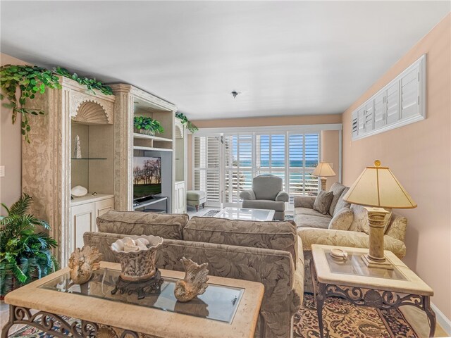 8444 Oceanside Dr Unit D31, Indian River Shores, FL 32963 - living room with baseboards